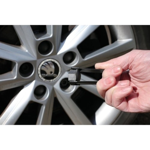 Wheel nut cap removal tool